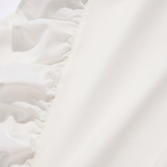 Emma Taylor Corsage-Overlay Ruffle Pullover β Detachable Floral Accent (White/Black)