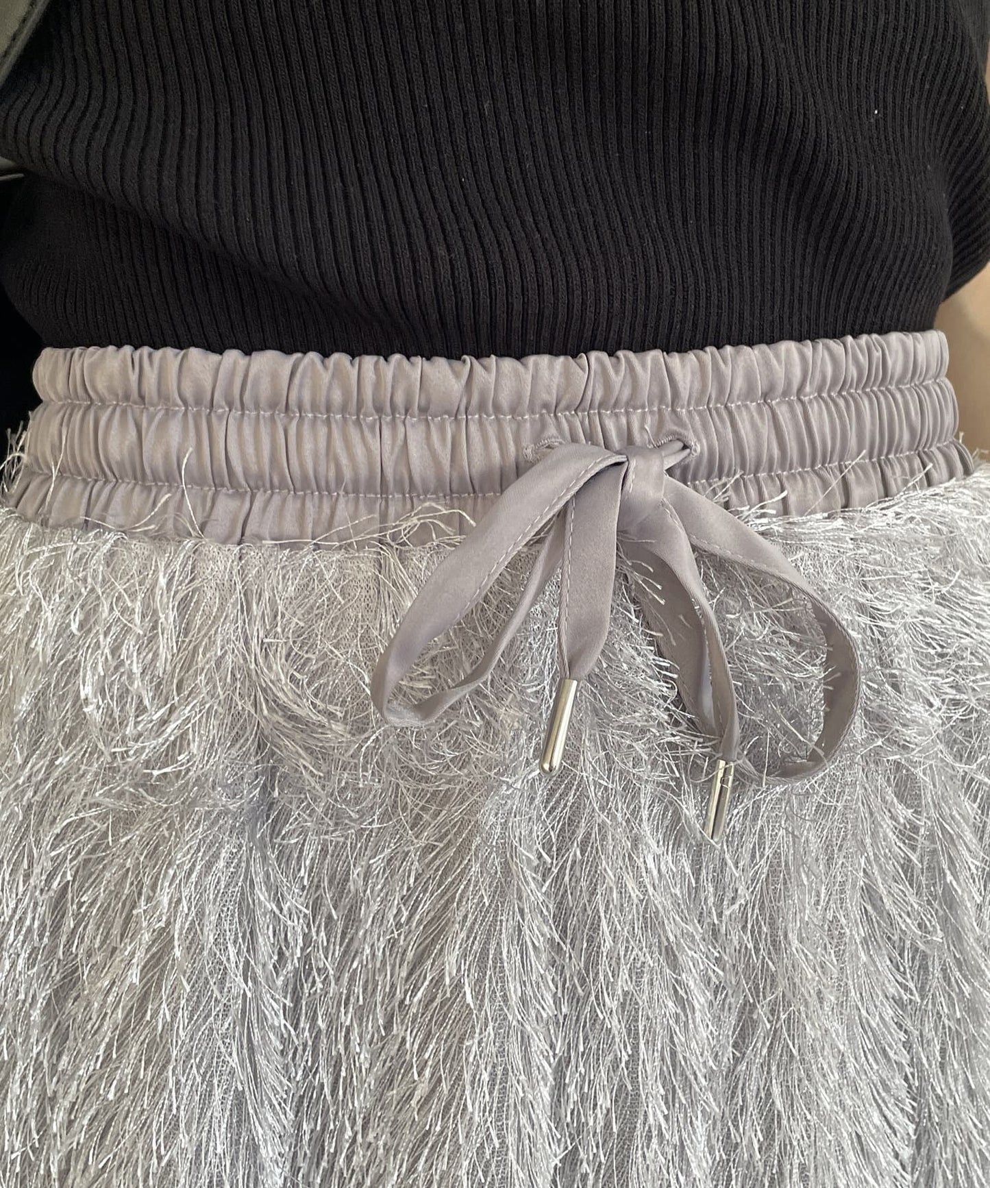 Thevon. Lame Fringe Narrow Skirt  Sparkle Fringe & Sleek Silhouette